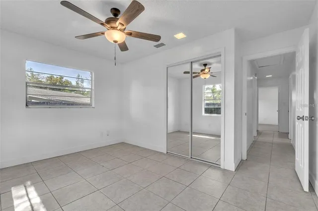 a view of an empty room with a bathroom