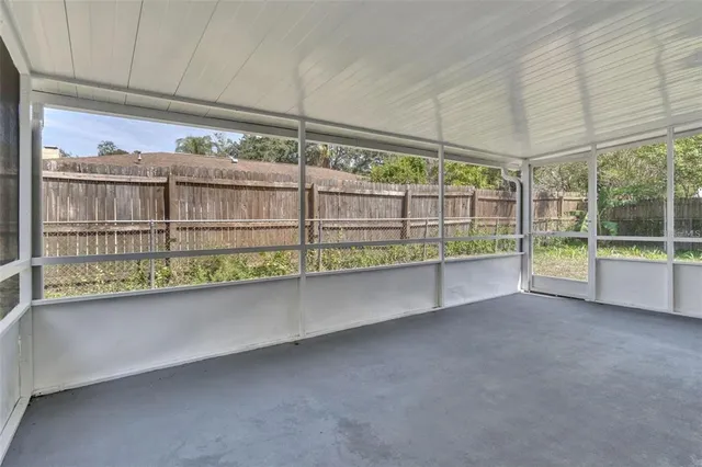 a view of a room with a large window