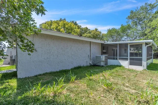 a view of a backyard with plants and a garden