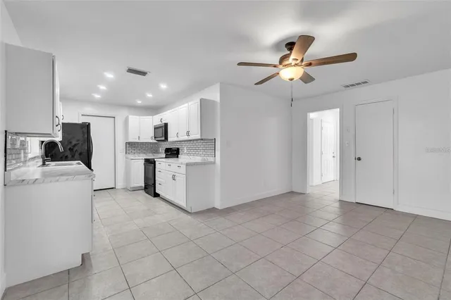 a view of a kitchen with electric appliances