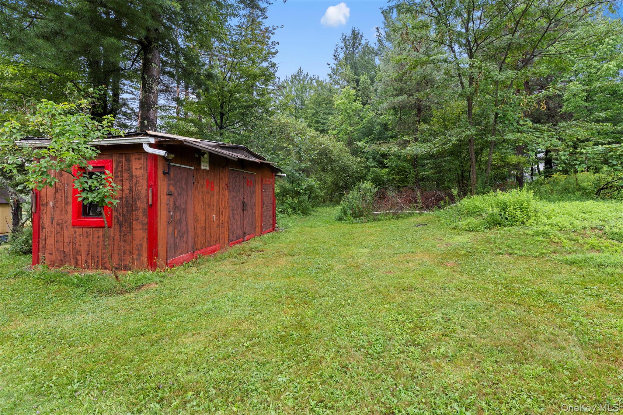 568 Old Liberty Road Monticello, NY 12701 - Photo 22 of 31 View of grassy yard with shed