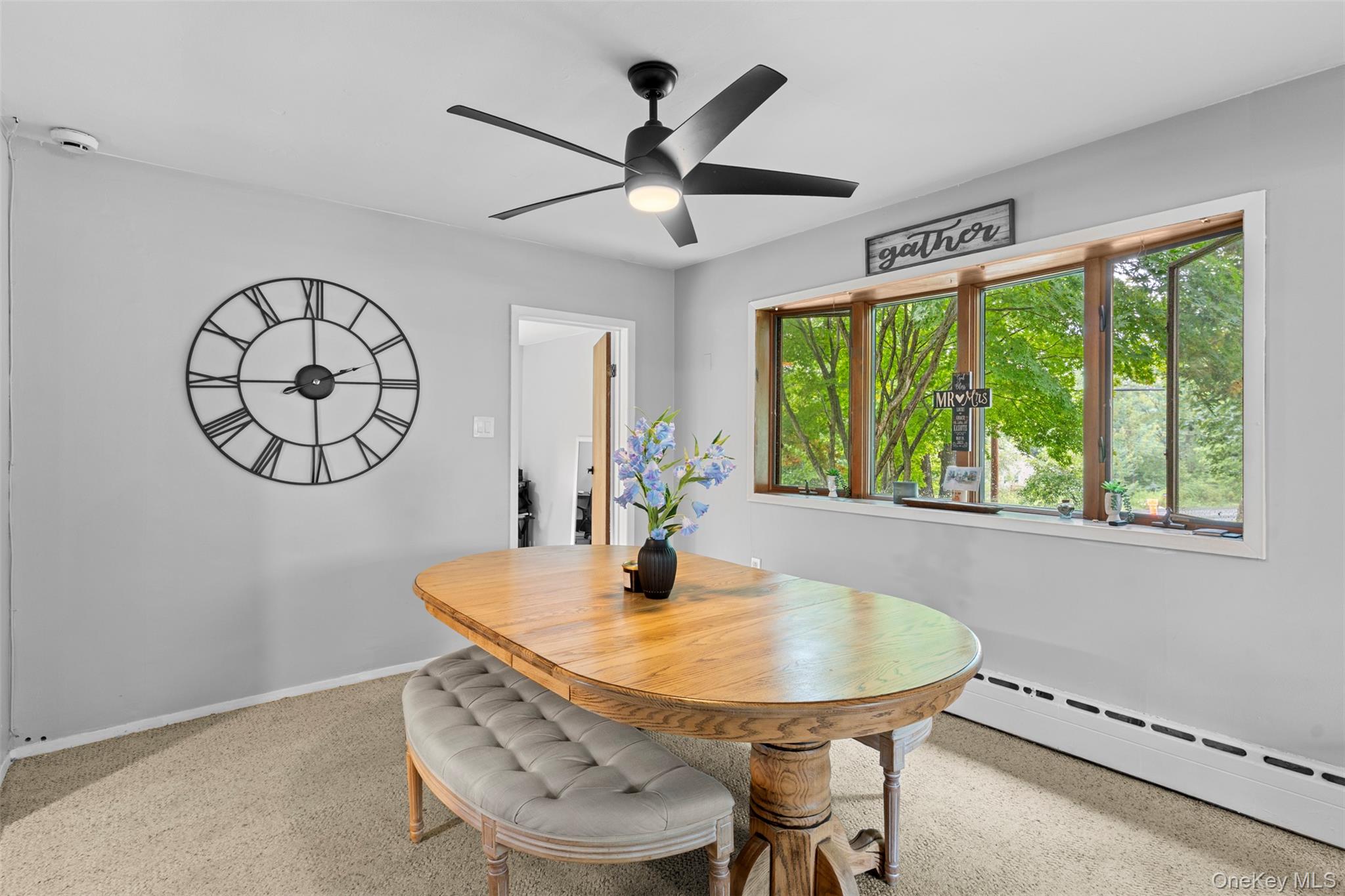 568 Old Liberty Road Monticello, NY 12701 - Photo 10 of 31 Dining space with large window and updated ceiling fan and light