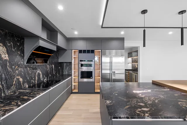 a view of wooden floor and windows in a room