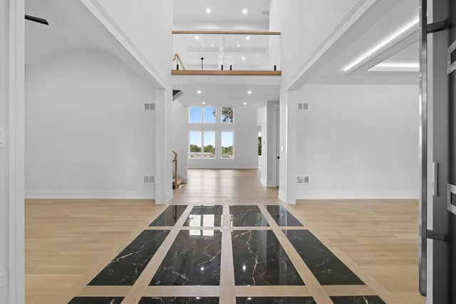 a spacious bathroom with a bathtub and window