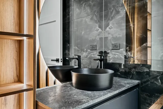 a front view of a house with a garden and sitting area