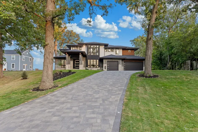 a open kitchen with stainless steel appliances granite countertop a stove and a refrigerator