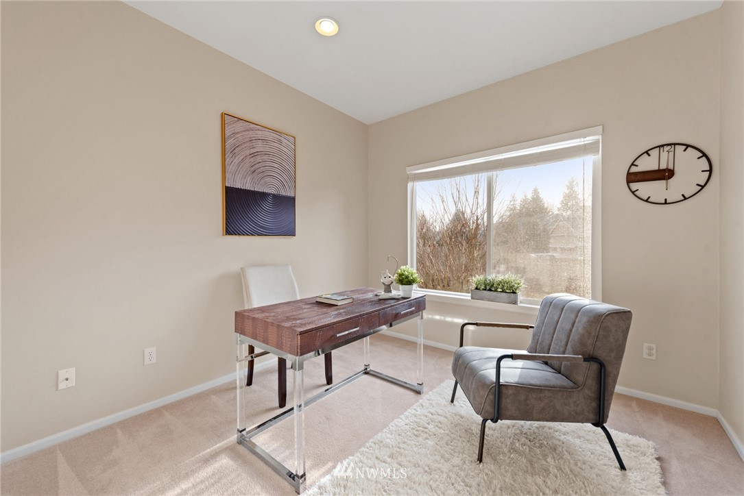 17567 Southeast 186th Way Renton, WA 98058 - Photo 11 of 28 a living room with furniture a table and a large window