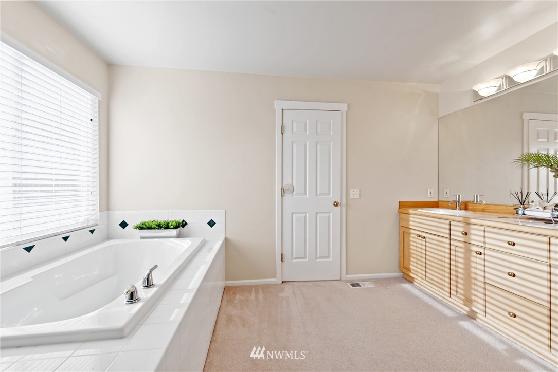 17567 Southeast 186th Way Renton, WA 98058 - Photo 16 of 28 a bathroom with a bathtub and a sink