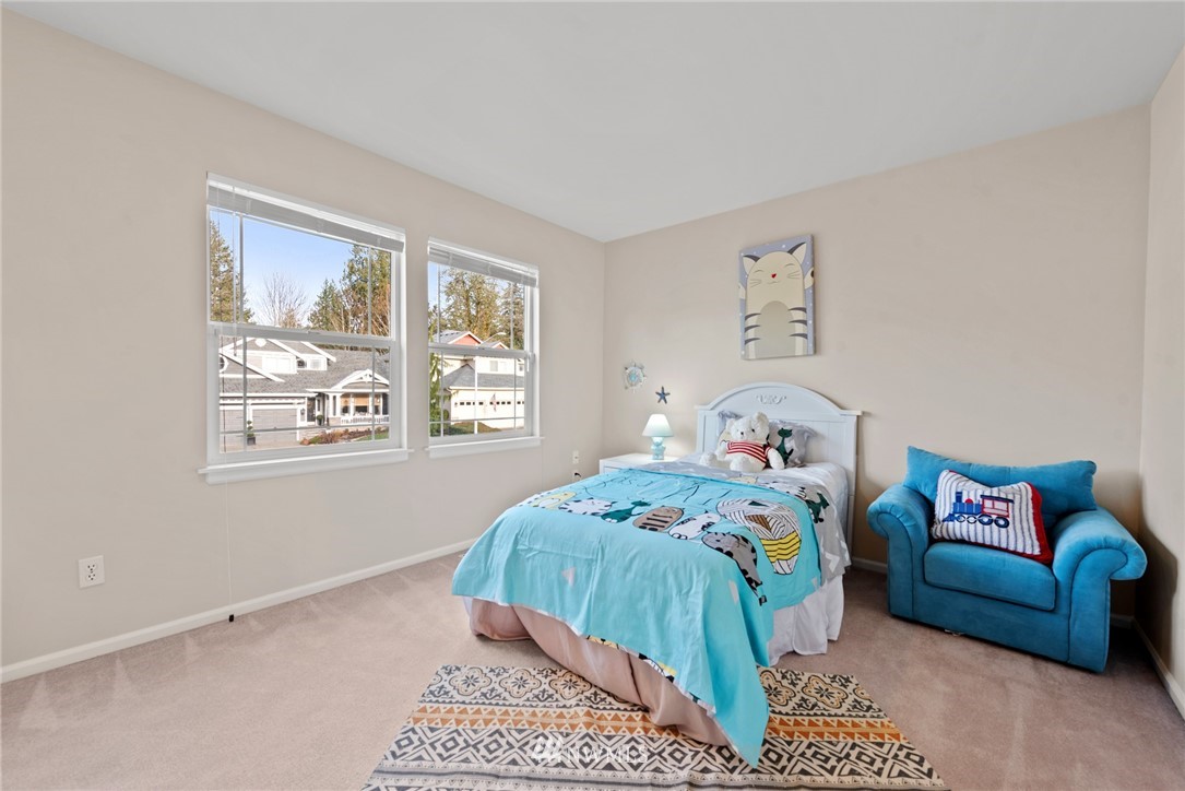17567 Southeast 186th Way Renton, WA 98058 - Photo 19 of 28 a bedroom with a bed and a couch
