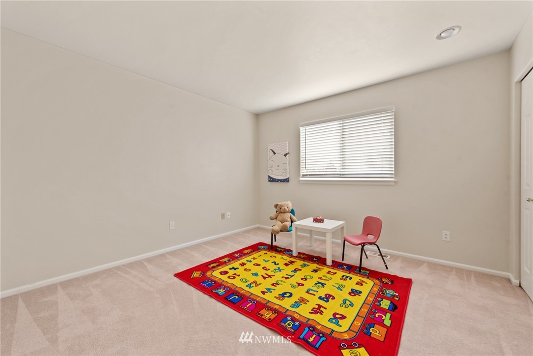 17567 Southeast 186th Way Renton, WA 98058 - Photo 20 of 28 a room with furniture and a rug