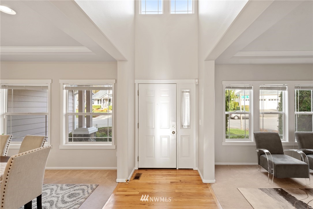 17567 Southeast 186th Way Renton, WA 98058 - Photo 2 of 28 a view of a livingroom with wooden floor and a livingroom space