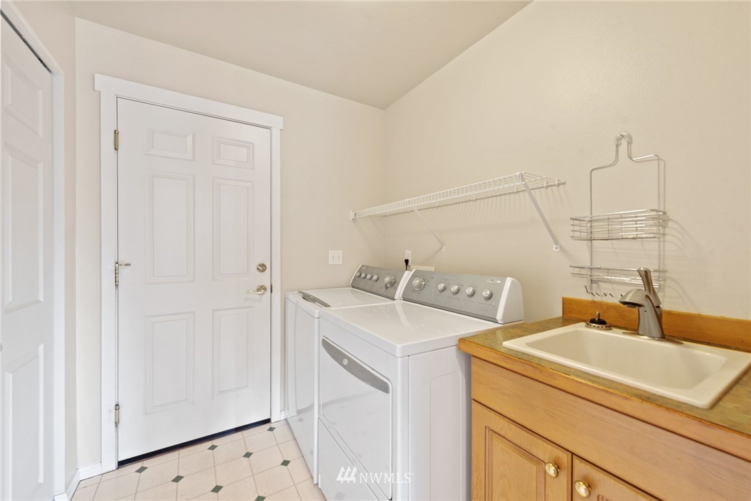 17567 Southeast 186th Way Renton, WA 98058 - Photo 24 of 28 a utility room with dryer and washer