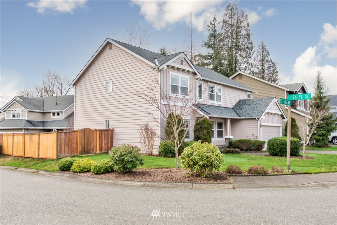 17567 Southeast 186th Way Renton, WA 98058 - Photo 25 of 28 a front view of a house with a garden and plants
