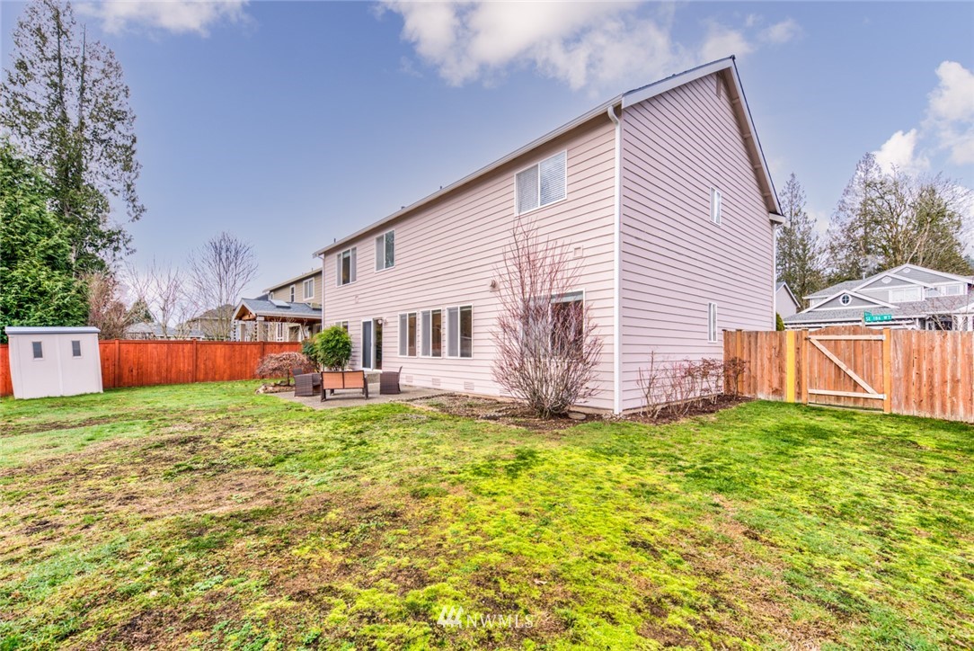 17567 Southeast 186th Way Renton, WA 98058 - Photo 27 of 28 a view of a house with a yard and sitting area