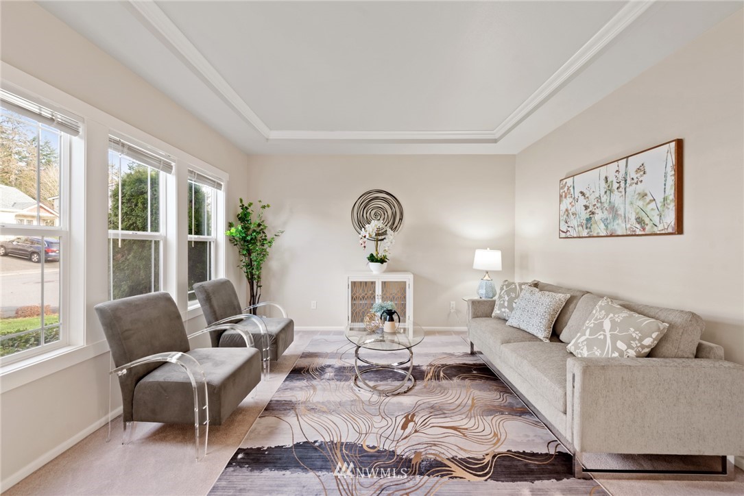 17567 Southeast 186th Way Renton, WA 98058 - Photo 4 of 28 a living room with furniture a large window and a potted plant