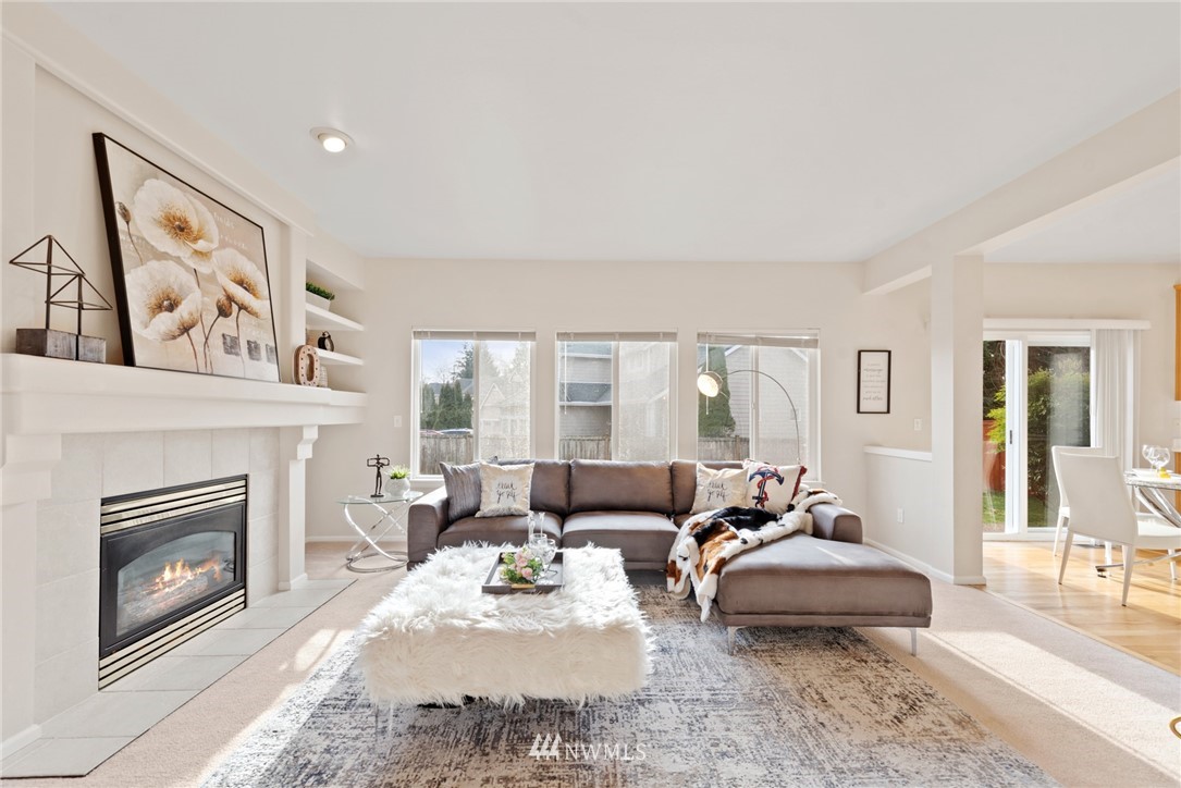 17567 Southeast 186th Way Renton, WA 98058 - Photo 6 of 28 a living room with furniture and a fireplace