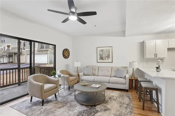 a living room with furniture and a large window