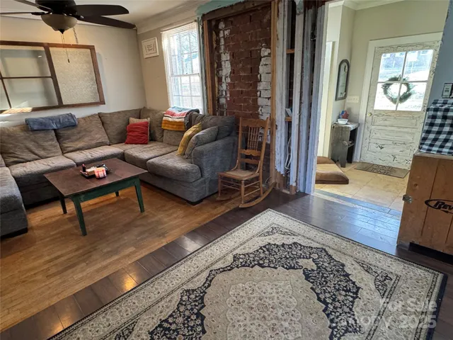 a living room with furniture and a rug