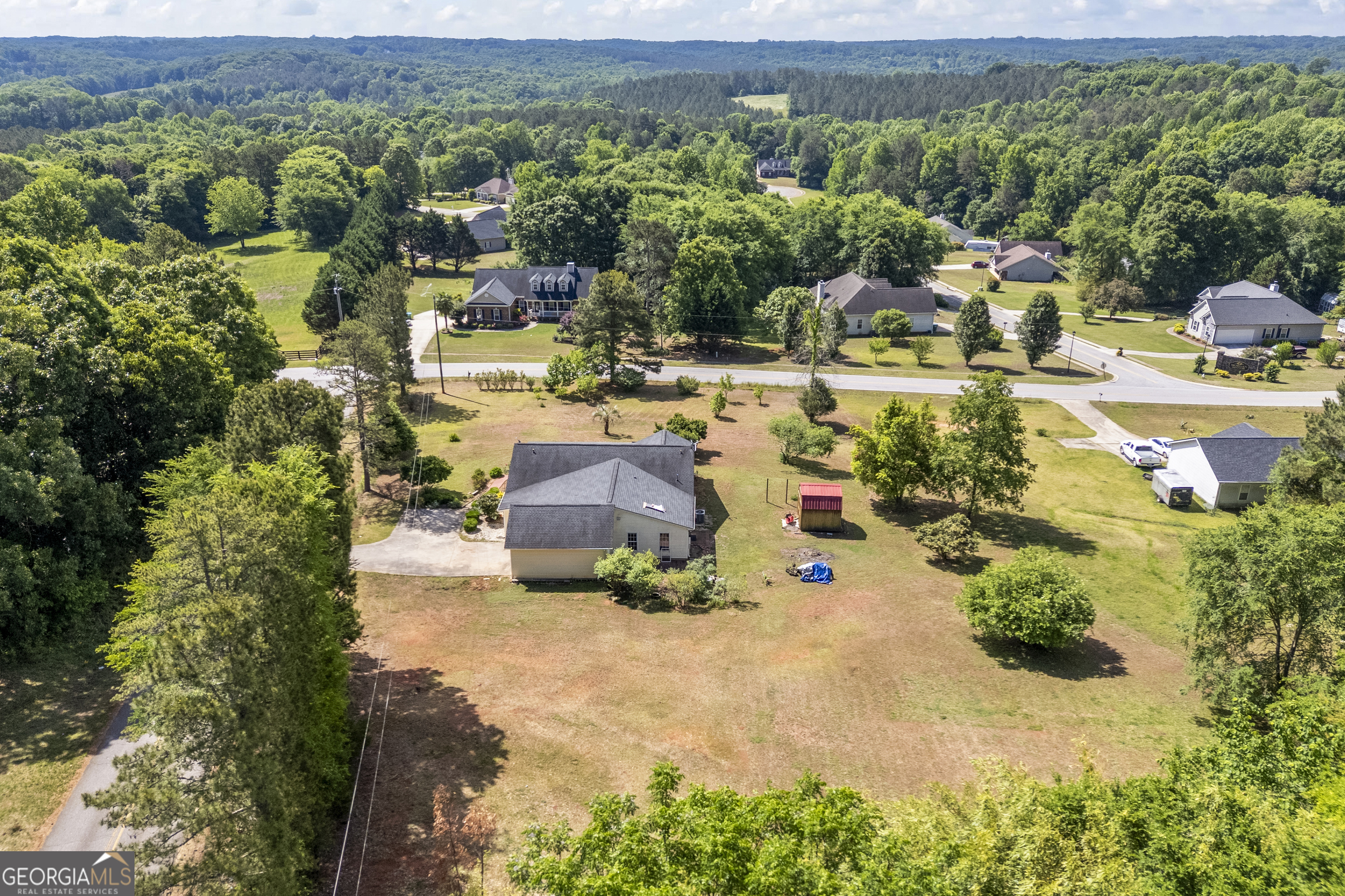 574 Mt Bethel Road Commerce, GA 30530 - Photo 15 of 64 an aerial view of a house with a yard and lake view
