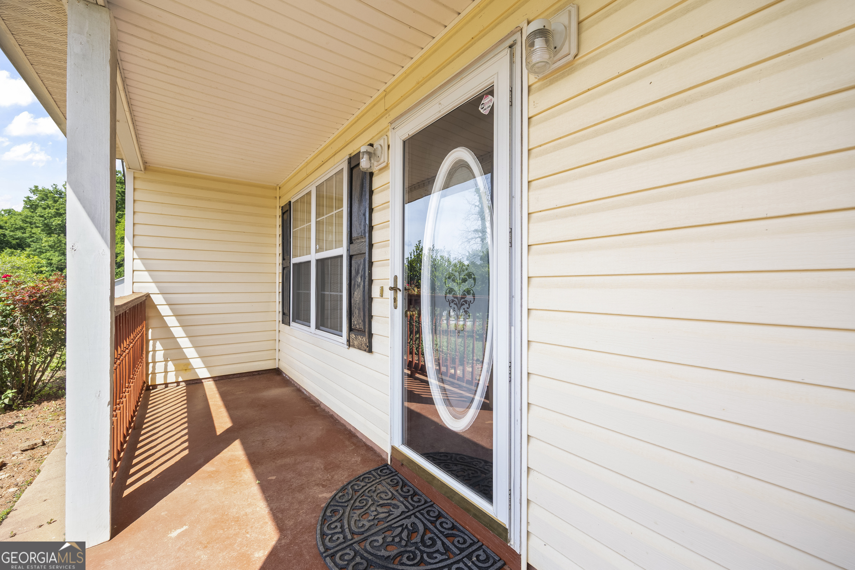 574 Mt Bethel Road Commerce, GA 30530 - Photo 19 of 64 a view of a balcony with wooden floor and fence