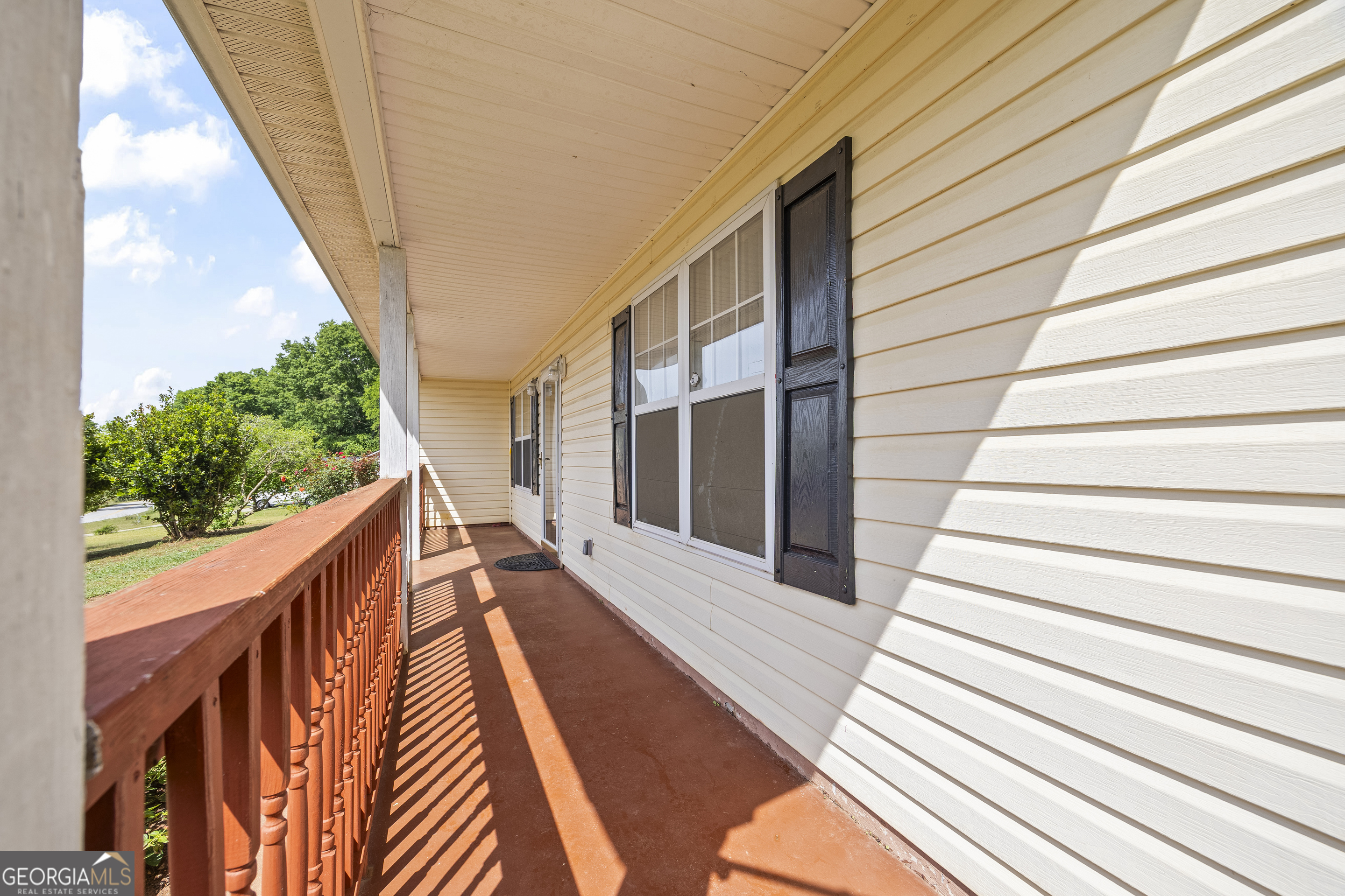 574 Mt Bethel Road Commerce, GA 30530 - Photo 21 of 64 a balcony with view of stairs and wooden floor