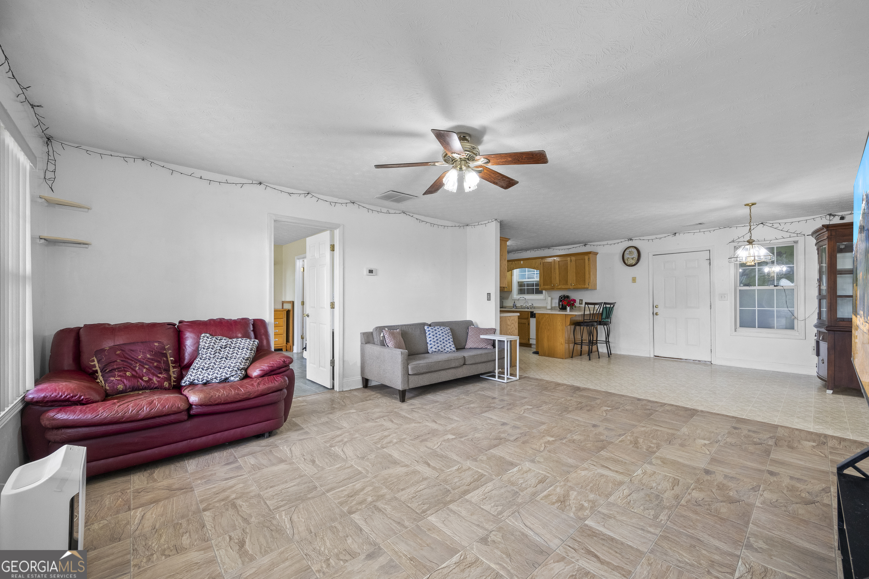 574 Mt Bethel Road Commerce, GA 30530 - Photo 22 of 64 a living room with furniture and a couch
