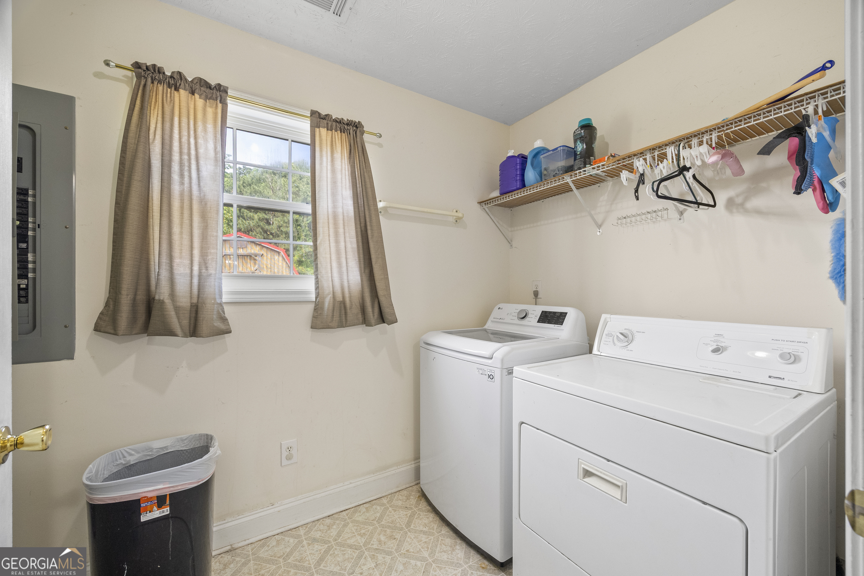 574 Mt Bethel Road Commerce, GA 30530 - Photo 33 of 64 a view of storage and utility room with washer and dryer