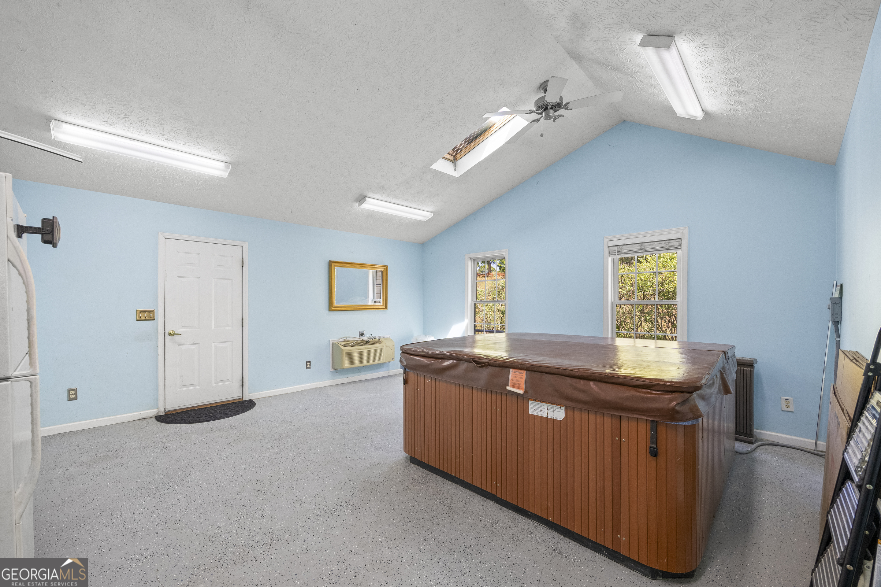 574 Mt Bethel Road Commerce, GA 30530 - Photo 36 of 64 a view of a room with kitchen island stainless steel appliances wooden floor and window