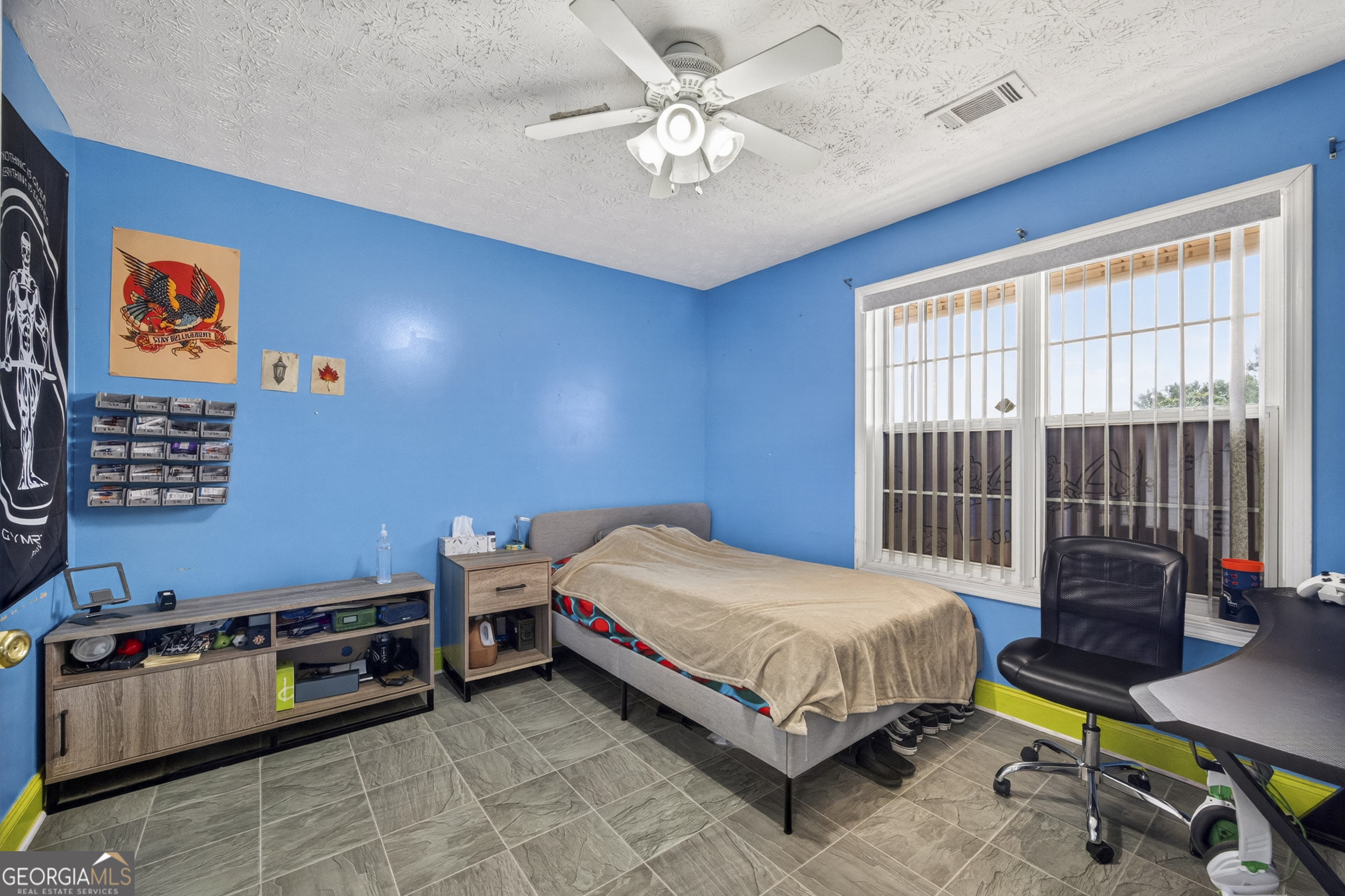 574 Mt Bethel Road Commerce, GA 30530 - Photo 47 of 64 a bedroom with a bed and a chandelier