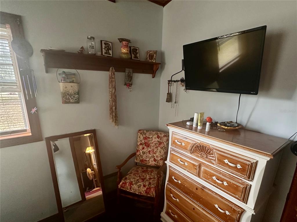 2807 Tindel Camp Road Lake Wales, FL 33898 - Photo 14 of 32 a living room with furniture and a flat screen tv
