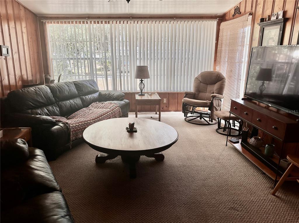 2807 Tindel Camp Road Lake Wales, FL 33898 - Photo 18 of 32 a living room with furniture and a flat screen tv