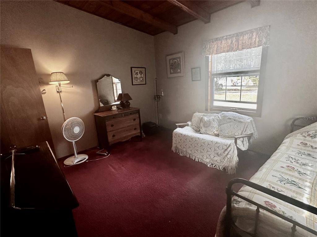 2807 Tindel Camp Road Lake Wales, FL 33898 - Photo 19 of 32 a bedroom with a bed and window