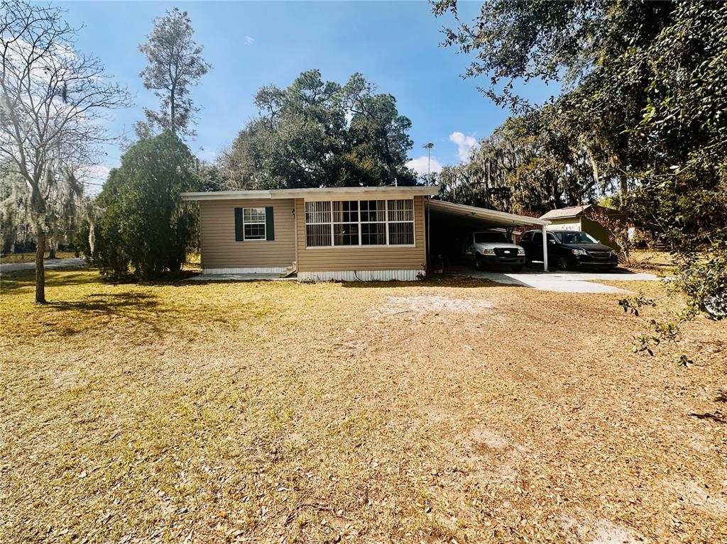 2807 Tindel Camp Road Lake Wales, FL 33898 - Photo 27 of 32 a front view of a house with a yard