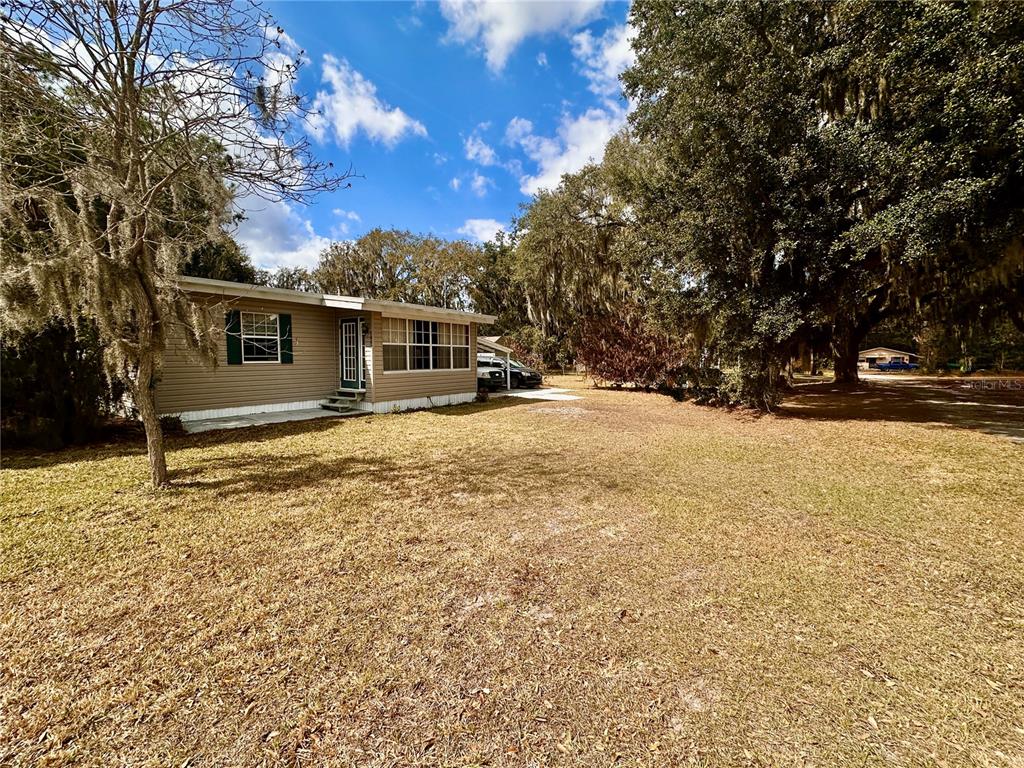 2807 Tindel Camp Road Lake Wales, FL 33898 - Photo 30 of 32 a view of a yard covered in snow
