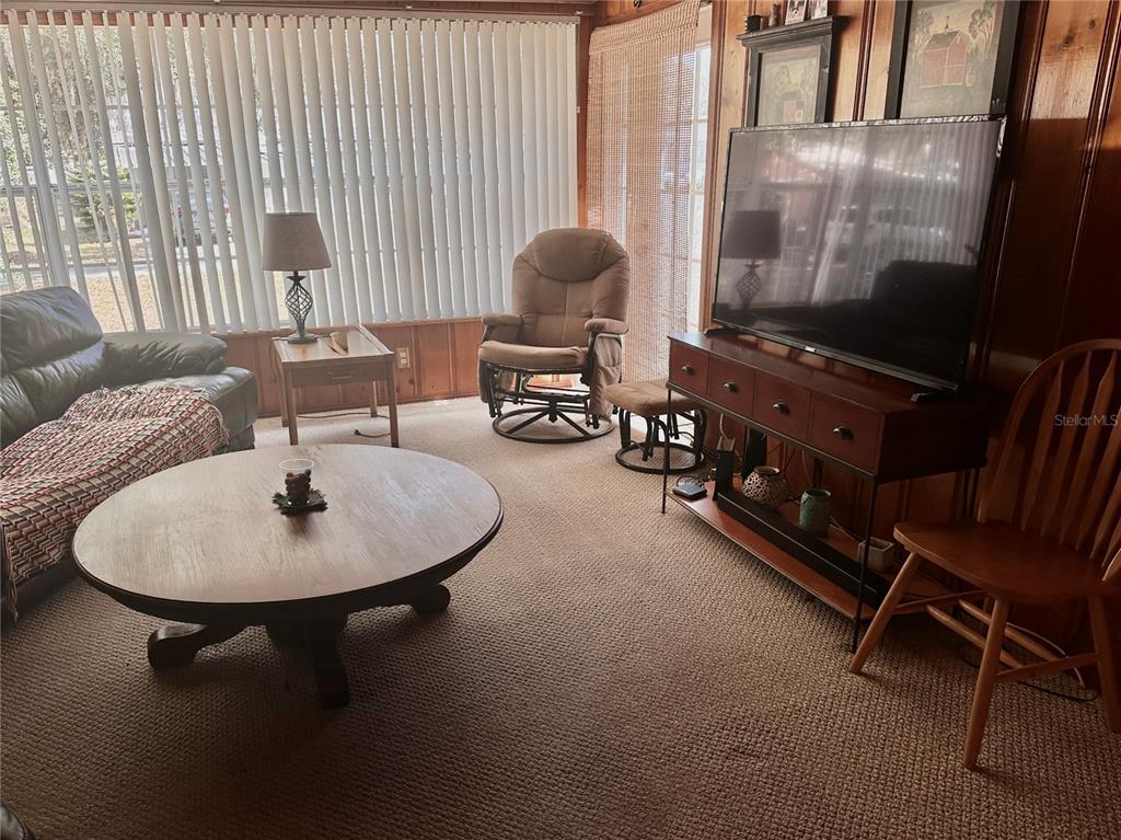 2807 Tindel Camp Road Lake Wales, FL 33898 - Photo 5 of 32 a living room with furniture and a flat screen tv