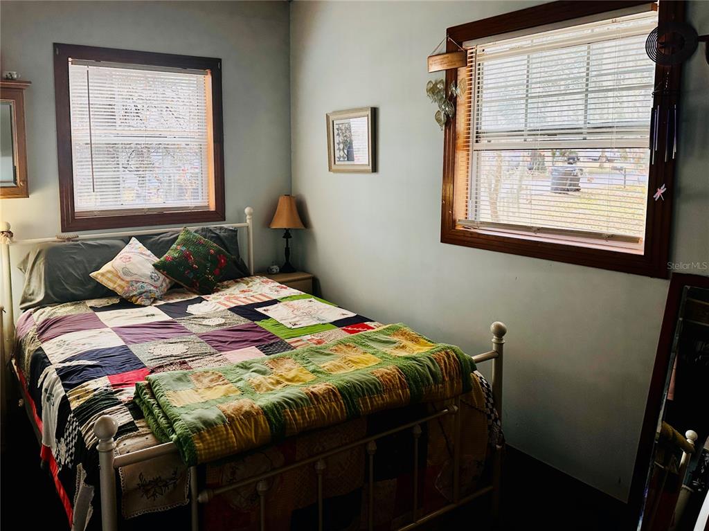 2807 Tindel Camp Road Lake Wales, FL 33898 - Photo 6 of 32 a bedroom with a bed and a window