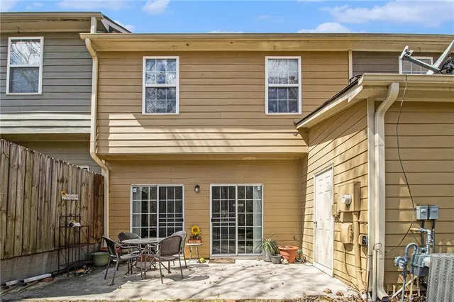 a view of a house with wooden walls