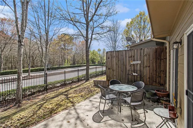 a view of a table and chairs in the patio