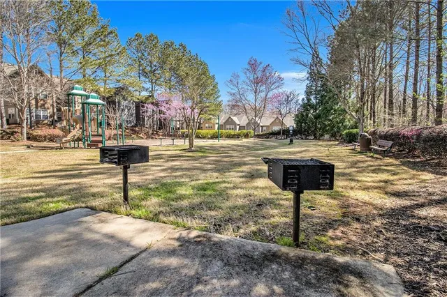 a swimming pool with some trees in the background
