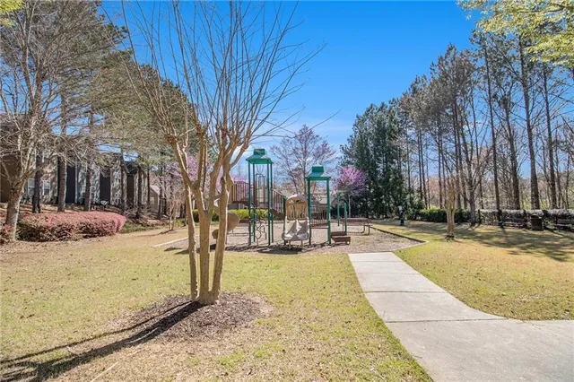 a view of a yard with snow on the road
