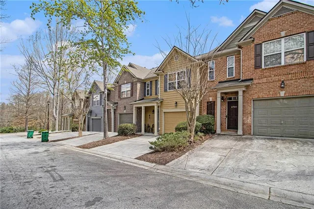 a view of road with large trees