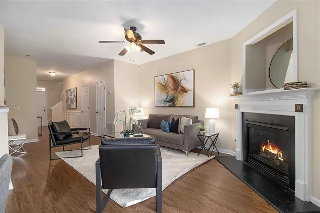 a living room with furniture and a fireplace