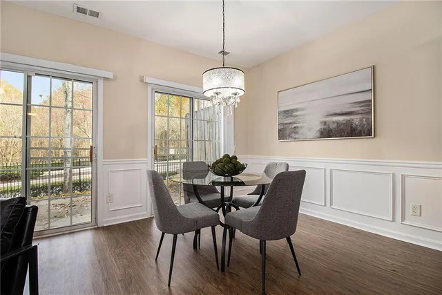 a dining room with furniture window wooden floor