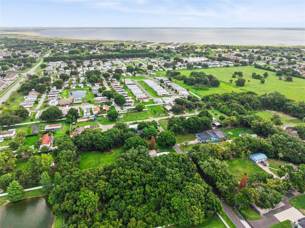 420 Jacks Memorial Road St. Cloud, FL 34769 - Photo 25 of 31 an aerial view of residential houses with outdoor space and trees