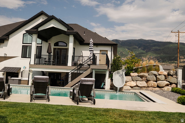 924 Country Lane Farmington, UT 84025 - Photo 82 of 91 Rear exterior featuring a multi-level design with a built-in pool and integrated water slide