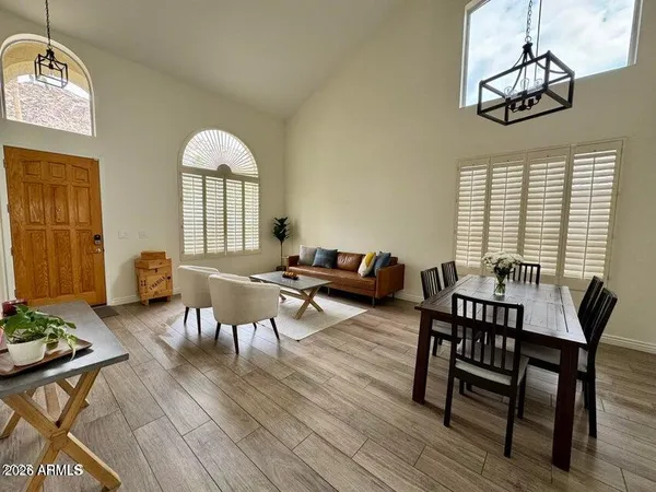 a view of a dining room with furniture window and wooden floor