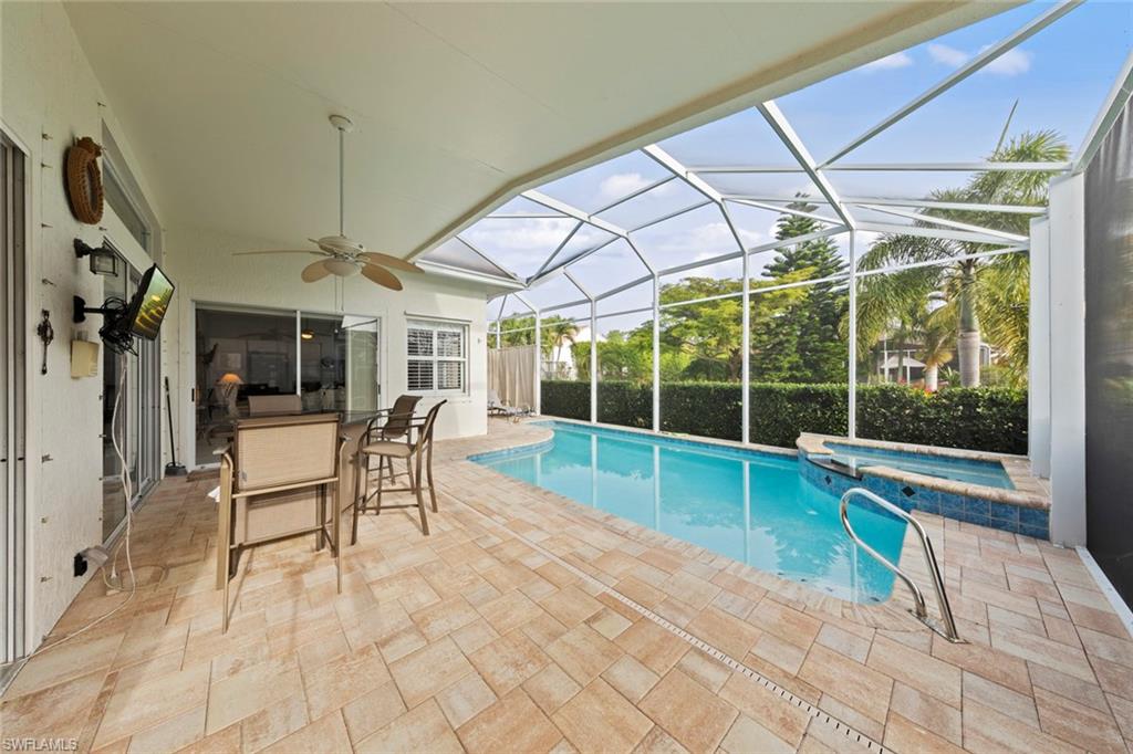 9057 Whitfield Drive Estero, FL 33928 - Photo 25 of 32 a view of a living room and a patio