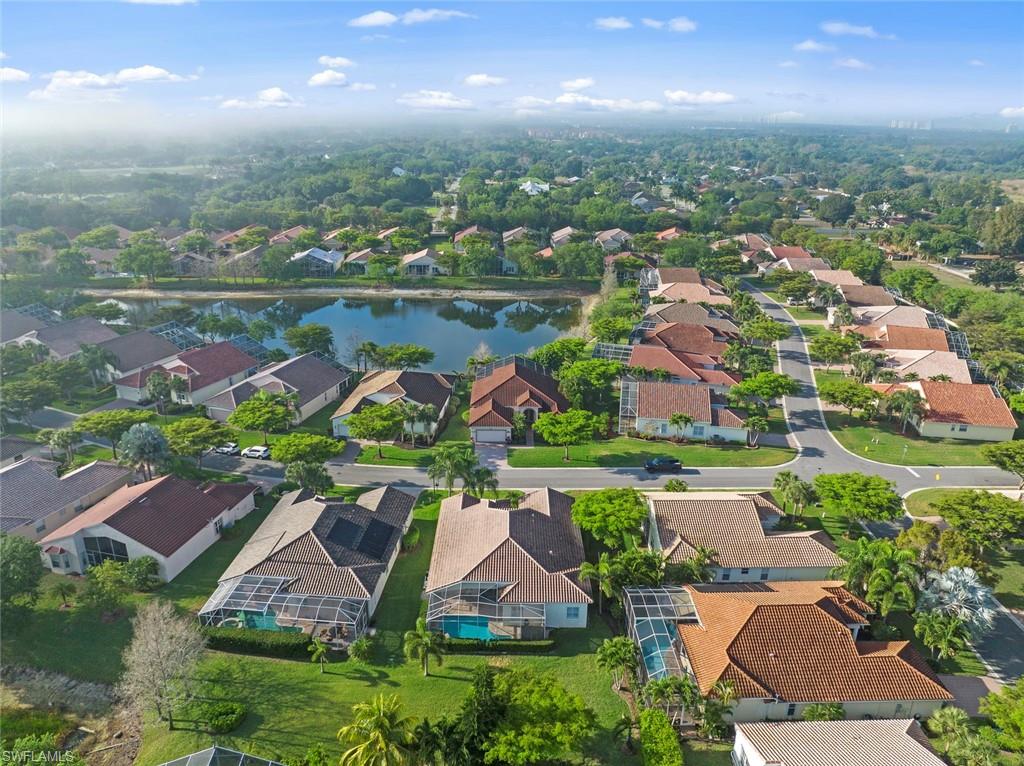 9057 Whitfield Drive Estero, FL 33928 - Photo 29 of 32 an aerial view of residential houses with outdoor space and pool