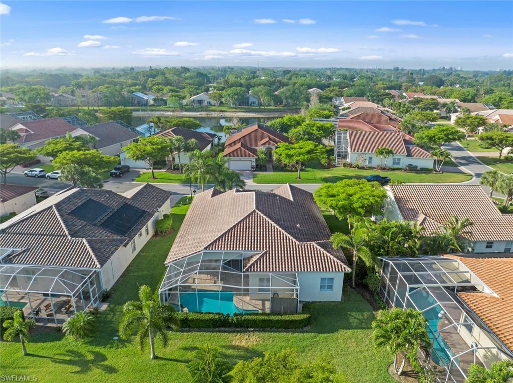 9057 Whitfield Drive Estero, FL 33928 - Photo 30 of 32 an aerial view of residential houses with outdoor space and street view
