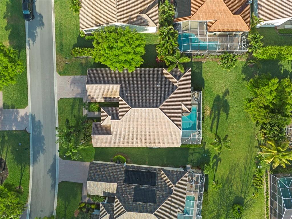 9057 Whitfield Drive Estero, FL 33928 - Photo 31 of 32 an aerial view of a house with a yard
